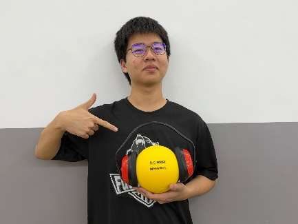 Team member with FUEL ball